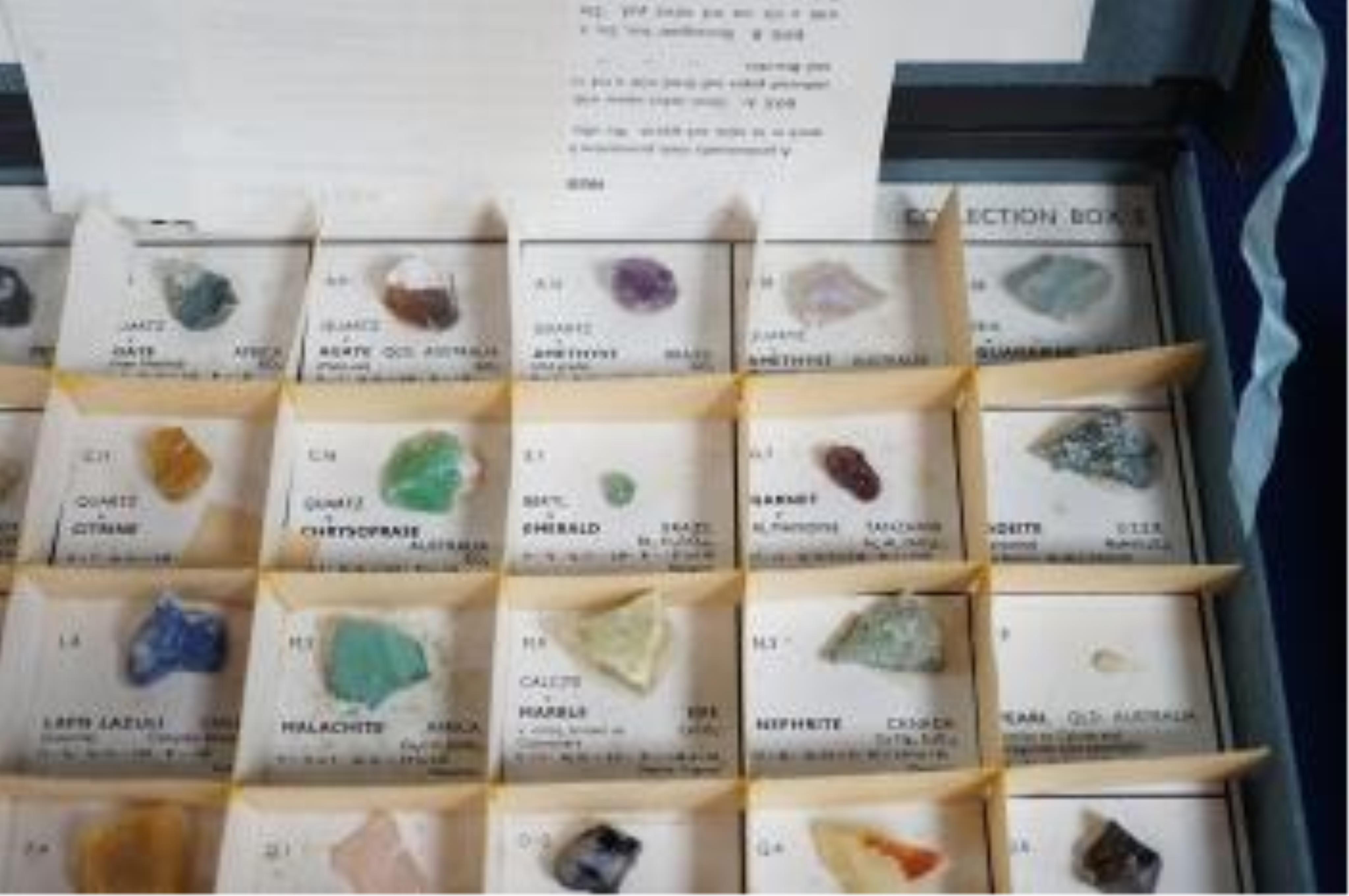 Three boxes containing unmounted cut gemstones including topaz, citrine, peridot, zircon, moonstone, etc. Condition - fair